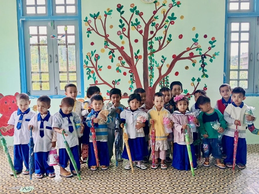 Children praying together at Joy Preschool